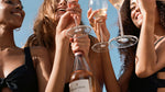 Group of young women smiliing and raising a glass of Wild Idol Alcohol Free Sparkling Rosé Wine