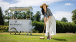 Lady enjoy a game of croquet to a backdrop of a mobile bar selling WILD IDOL Alcohol Free Sparkling Wine