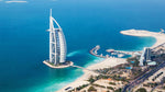 Aerial view of the Burj Al Arab hotel and Jumeirah Beach in Dubai, with clear blue waters. Enjoy non alcoholic champagne Dubai style.