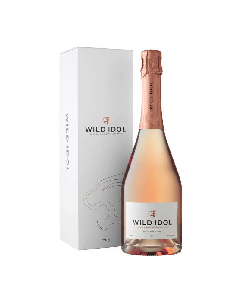 A bottle of Wild Idol Alcohol Free Sparkling Rosé Wine next to its box