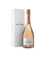 A bottle of Wild Idol Alcohol Free Sparkling Rosé Wine next to its box