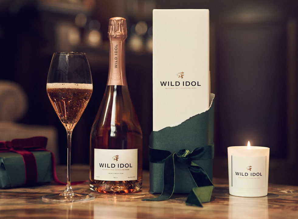 WILD IDOL Alcohol Free Sparkling Rosé Wine and exclusive candle.