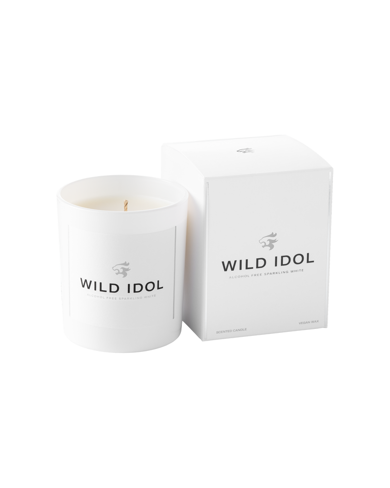 WILD IDOL White Candle next to its box