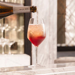 Winter Berry Spritz cocktail, made with Wild Idol alcohol free sparkling Rosé wine